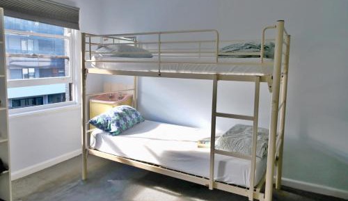 Bed in 6-Bed Female Dormitory Room with Shared Bathroom